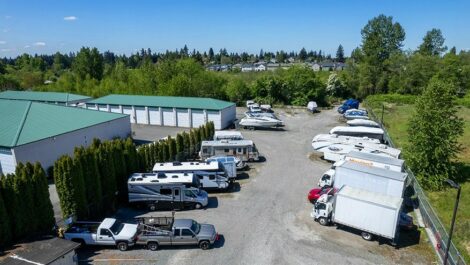 parking lot with rv and car parked