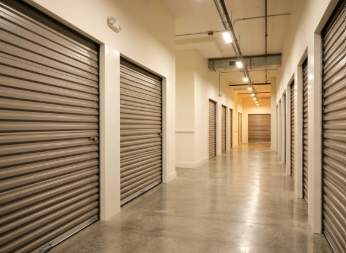 Indoor, climate-controlled storage unit hallway.